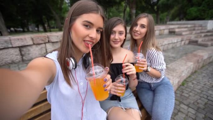 Three girlfriends making selfies