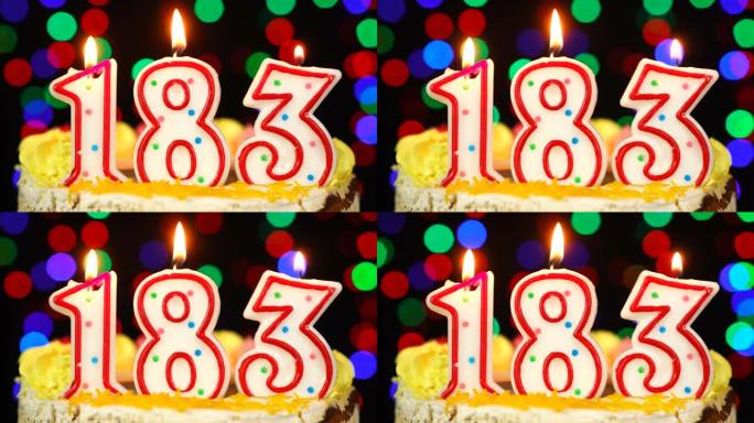 183号生日快乐蛋糕与燃烧的蜡烛顶。