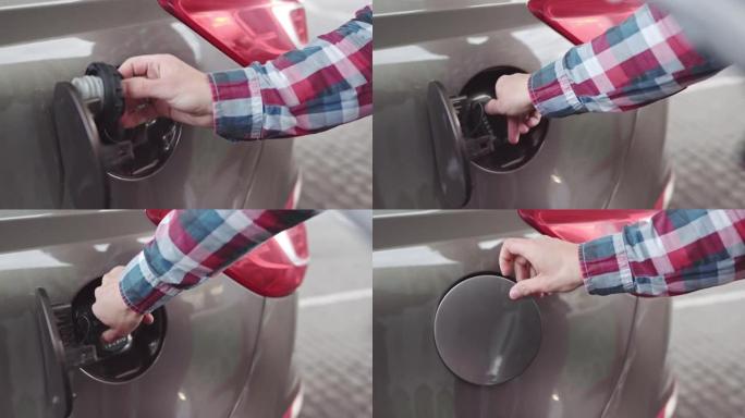 一名男子在加油站的汽车中加柴油的特写镜头。满柴油箱，加油结束。该名男子将加油枪从机油箱中拉出，并关闭