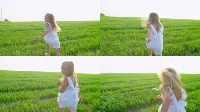 穿着白色连衣裙的金发小可爱女孩在绿色的田野上奔跑，微笑着。孩子，孩子在花园里跑，笑。美丽，自然，爱，