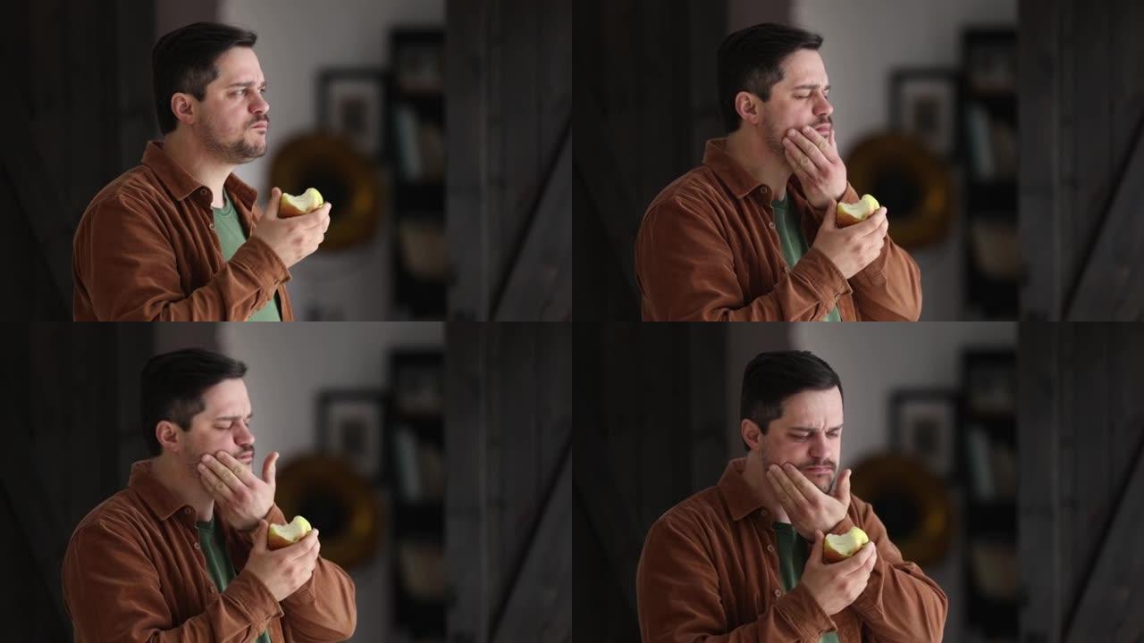 男人在家里吃苹果时断了牙