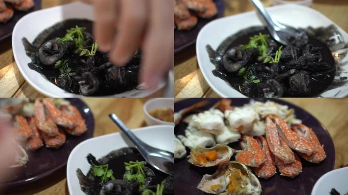 泰国海鲜黑墨炒鱿鱼蒸蟹美味当地沙滩美食