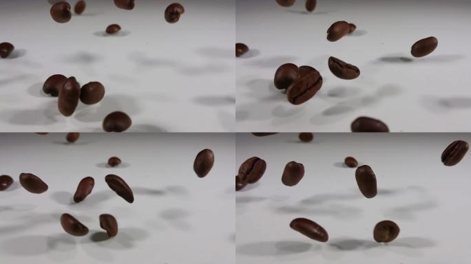 烤咖啡豆掉落并在白色表面上弹跳的特写镜头