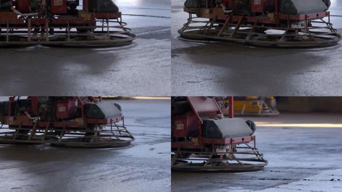 带操作员的机器抹刀用于研磨水泥表面