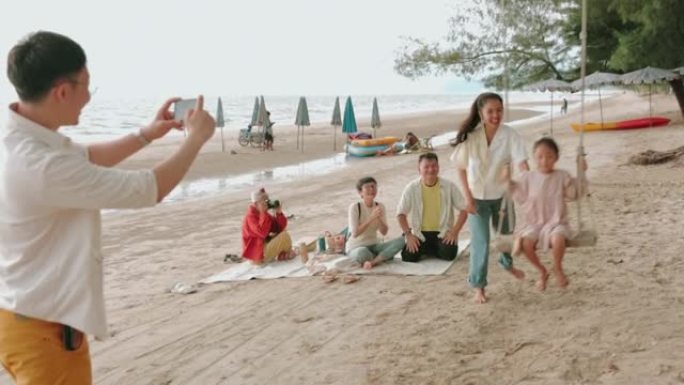 与大家庭一起在海滩上度过有趣的假期-股票视频