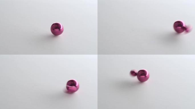 粉色磁球互相吸引，做旋转重力舞