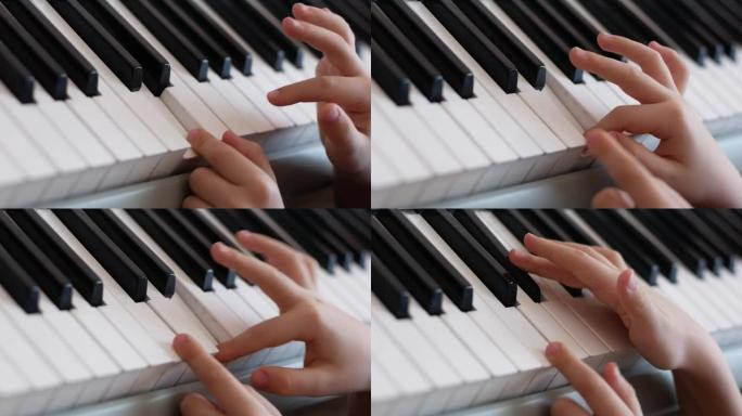 孩子弹钢琴主题。学习弹钢琴的男孩的手指特写。儿童的创造力。弹钢琴。选择性聚焦，浅景深