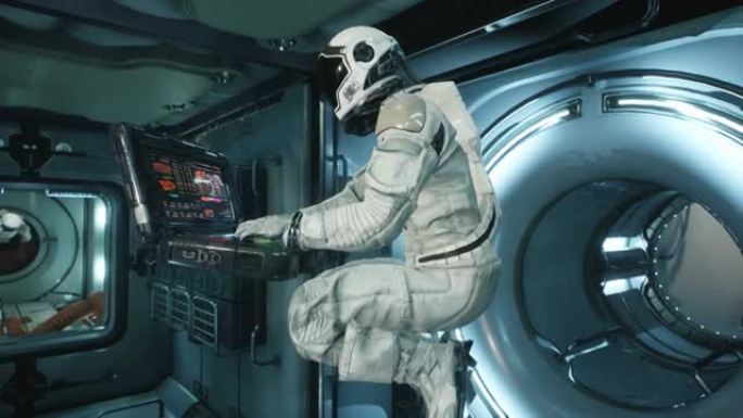 宇航员在宇宙飞船上零重力的笔记本电脑上工作。该动画适用于科幻，未来派或太空旅行背景。