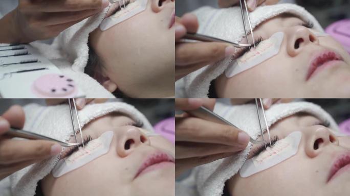 亚洲化妆师制作睫毛沙龙程序。女人的睫毛延伸。专业佩戴医用口罩帽子和个人防护用品套房，新型冠状病毒肺炎