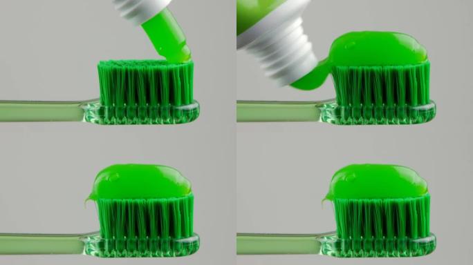 绿色牙膏放在白色背景上的绿色牙刷上特写。