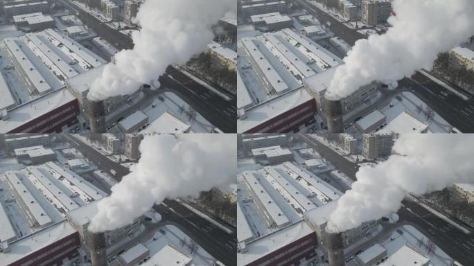 污染的镜头。白烟来自位于大城市中心的一个巨大的工业工厂烟囱，周围有居民区。