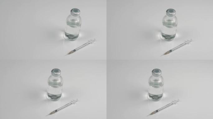 带有白色背景上的一罐药用注射器，用于流感的药物俯视图，针对病毒的疫苗。