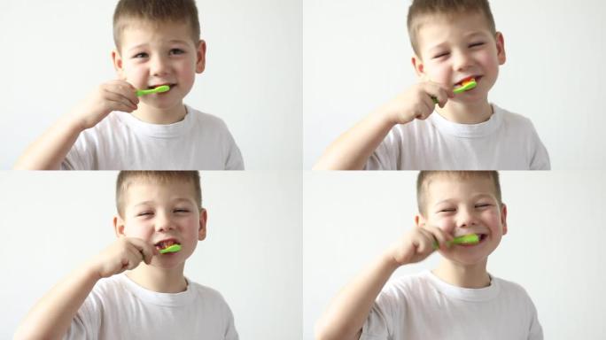小男孩用牙刷和口腔糊剂刷牙，清洁牙齿。学习牙科教育