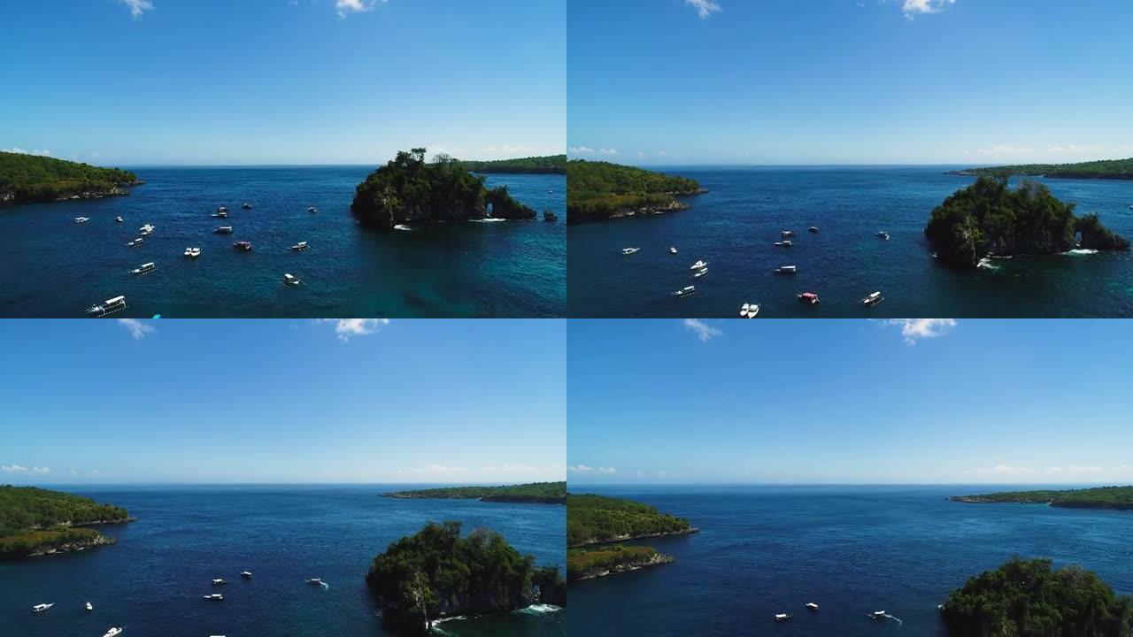 传统和旅游巴厘岛龙舟漂流在水晶湾海滩鸟瞰图