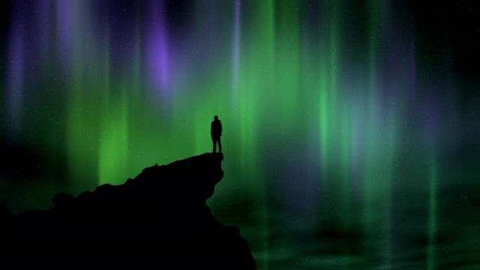 站在悬崖边看夜空和北极光的男人的剪影