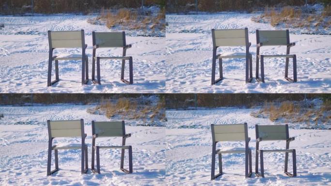 冬季，空冻湖旁的沙滩椅，4k慢动作60fps