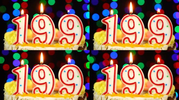 199号生日快乐蛋糕与燃烧的蜡烛顶。