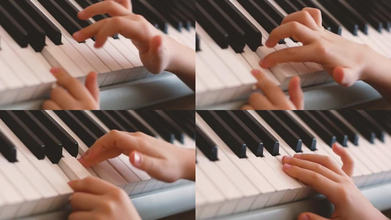 教孩子演奏乐器的主题。一个孩子的手弹琴键的特写镜头。学龄前男孩弹钢琴选择性聚焦浅景深