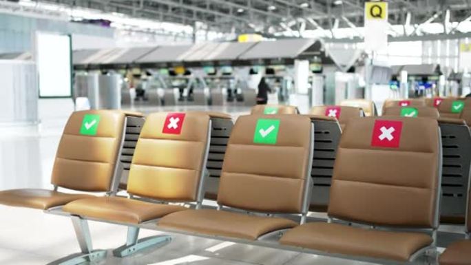 机场椅子上的社交距离符号。