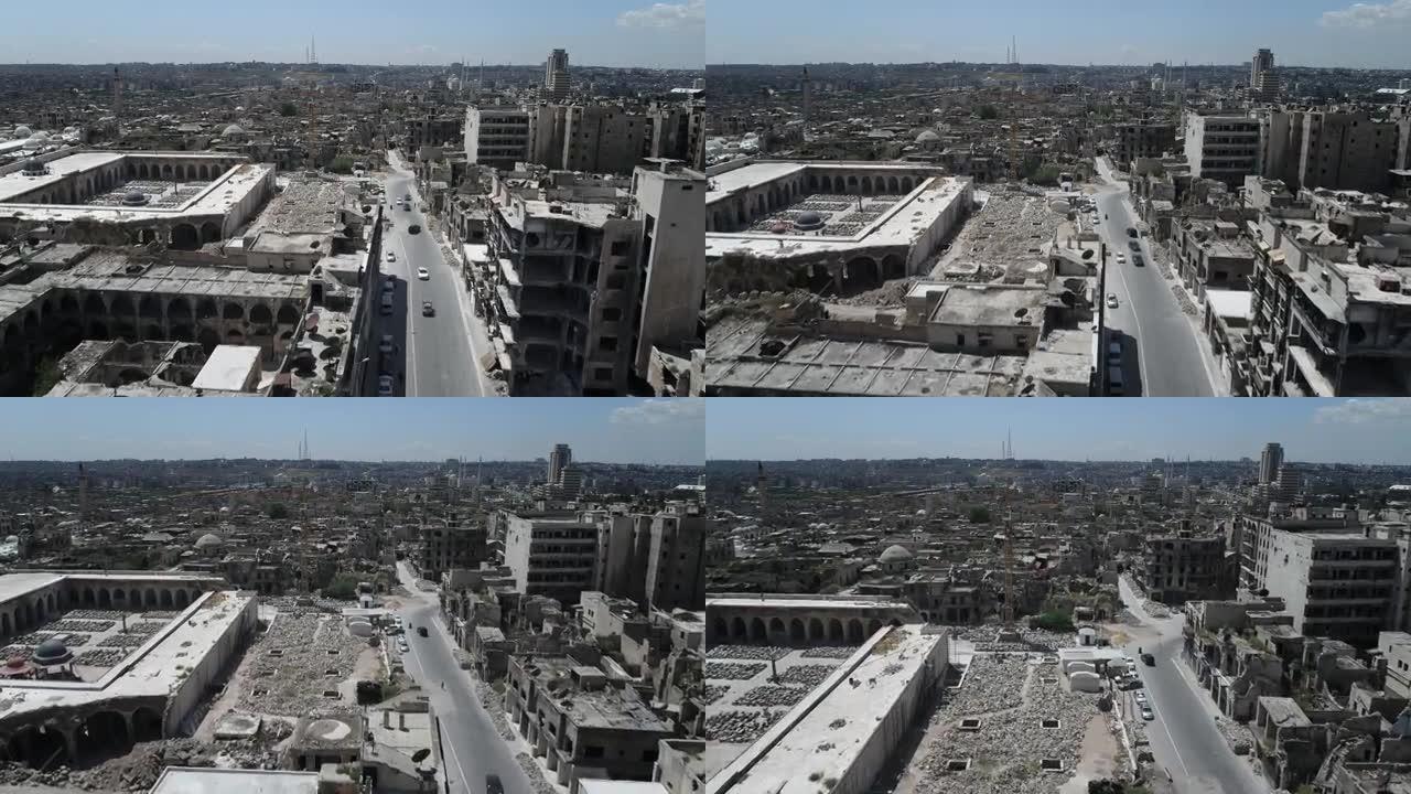 叙利亚城市的街道上有汽车和行人。一些建筑在10年前的内战后仍然是废墟- 4K无人机的鸟瞰图