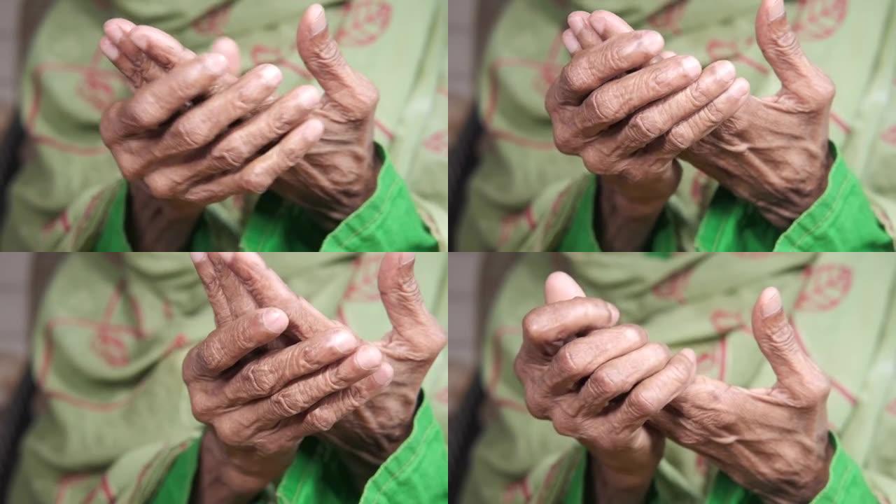 无法识别的老年妇女的手手腕疼痛，