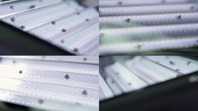 具有单个强大LED芯片和金属光泽反射器的照明灯具的特写镜头，以节省能源
