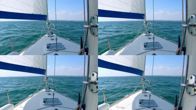 游艇航行在游艇暑假巡航。晴天在公海航行的游艇。4k慢动作