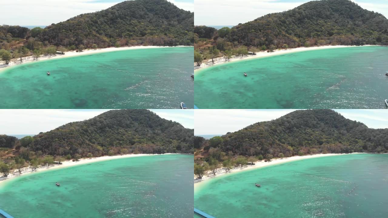 金色沙滩在泰国Koh Hey (珊瑚岛) 香蕉海滩的翡翠浅水区旁-空中飞越全景拍摄