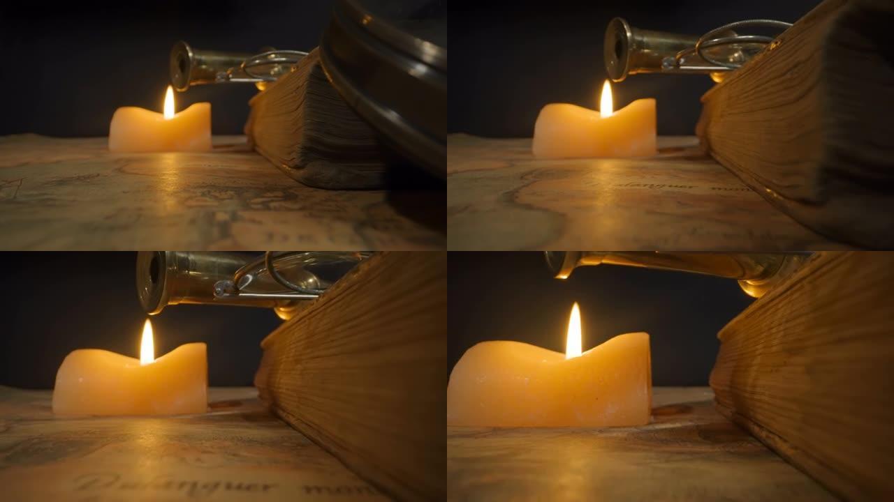 仔细看桌子上的厚书和蜡烛