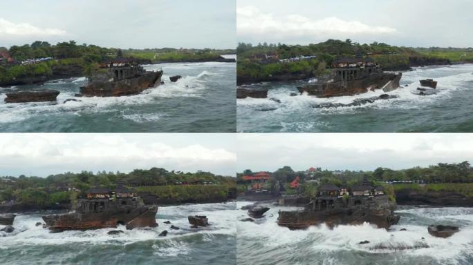 印度尼西亚巴厘岛的丹那·洛特神庙 (Tanah Lot temple) 撞上了岩石悬崖。空中射击环绕