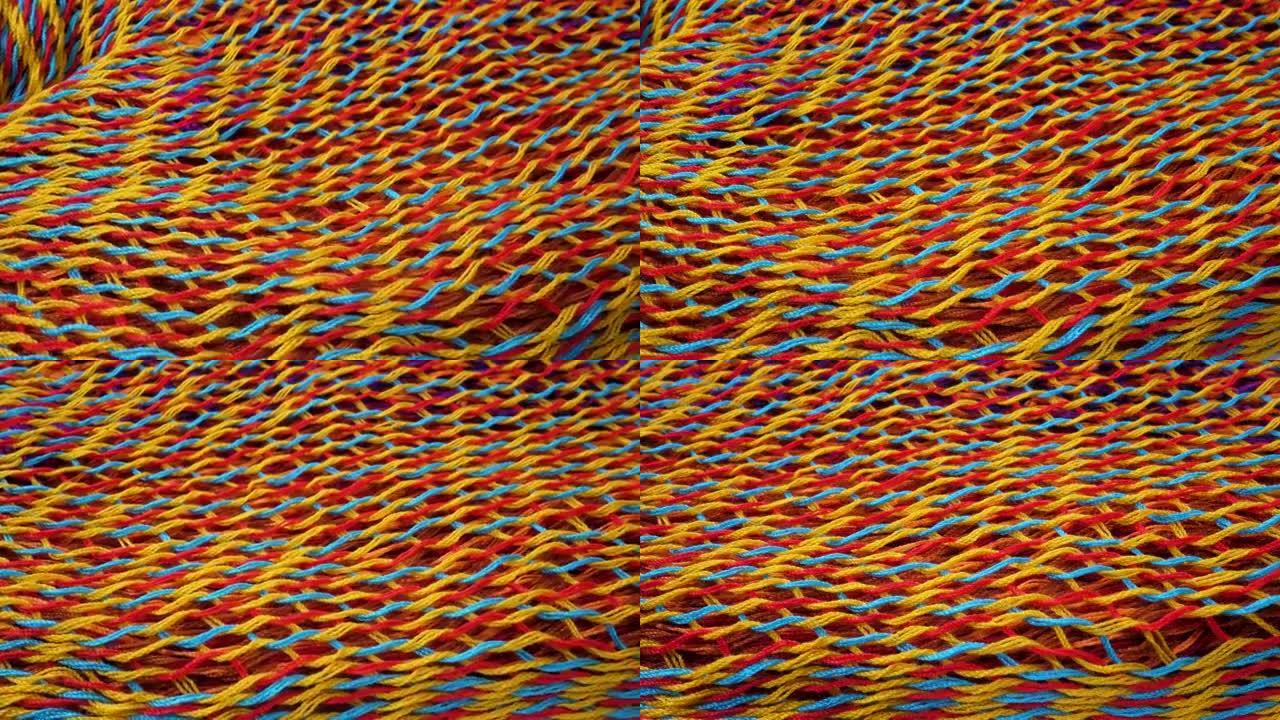 蓝色、红色、黄色针织面料抽象背景面料