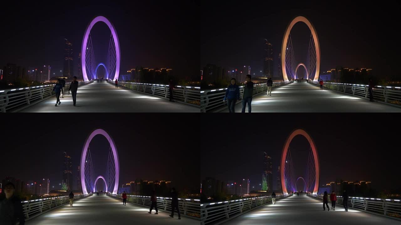 夜间照明南京市国际青年文化中心河边人行眼桥全景4k中国