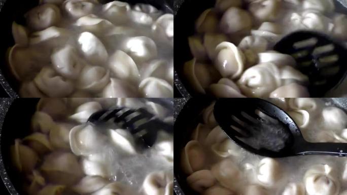 手工制作的西伯利亚pelmeni。俄罗斯pelmeni一种用切碎的肉或鱼塞满新鲜面团的煮沸产品形式的