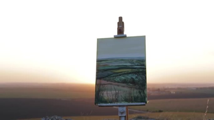 日落时站在乡村画架上的绘画