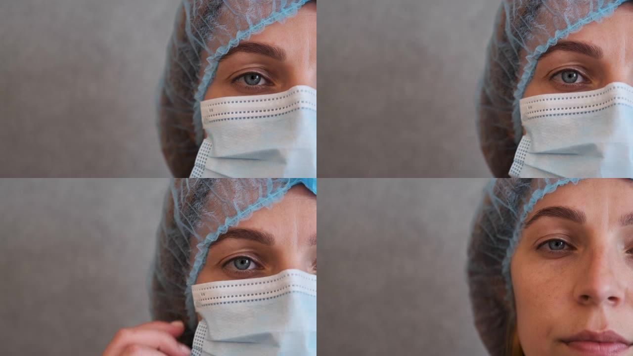冠状病毒期间带有保护性医疗帽和外科口罩的护士