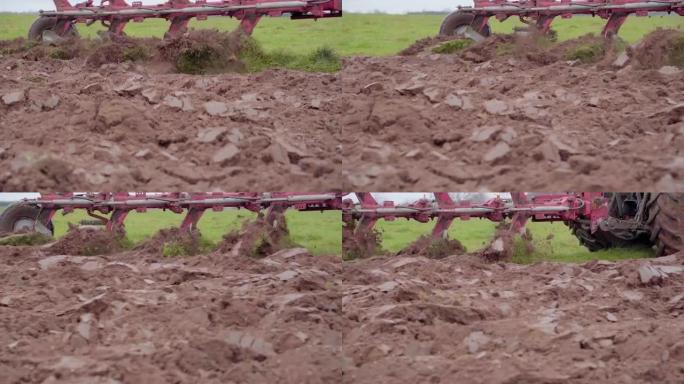 拖拉机田间耕作-超慢动作近距离观察，泥土和泥土飞溅