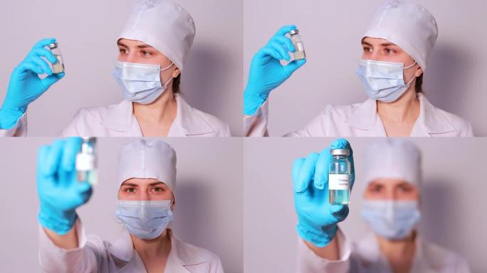 戴着医用口罩的医生或实验室技术人员将破伤风疫苗保持在白色背景上。卫生保健中疫苗接种的概念