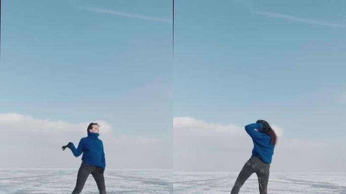 千禧一代女性职业舞者的垂直视频，在寒冷的冬天在冰冻的湖上跳舞充满活力的爵士放克或嘻哈。女性潮人在冰雪