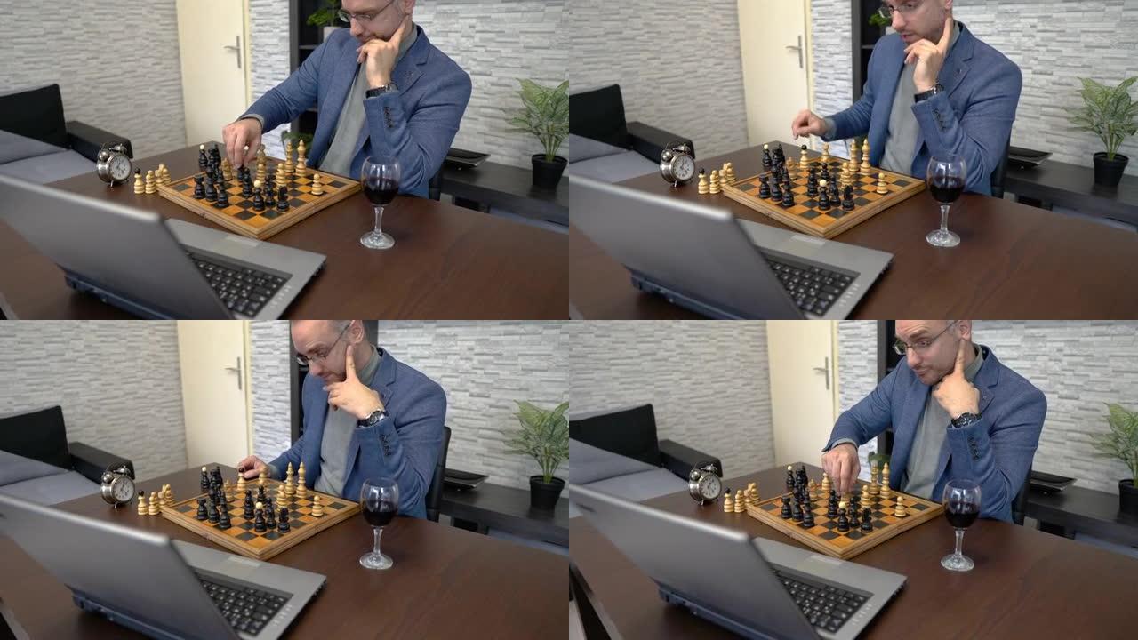 男子在笔记本电脑上使用视频会议与朋友下棋
