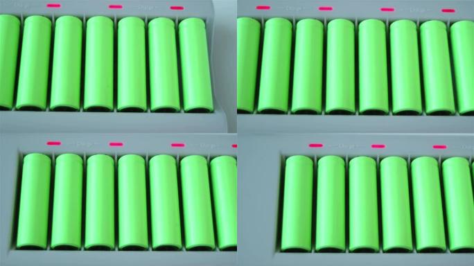充电器里有很多绿色的锂离子电池。滑行视图
