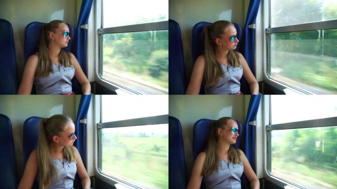 戴墨镜的女孩在火车上看着窗外，笑着