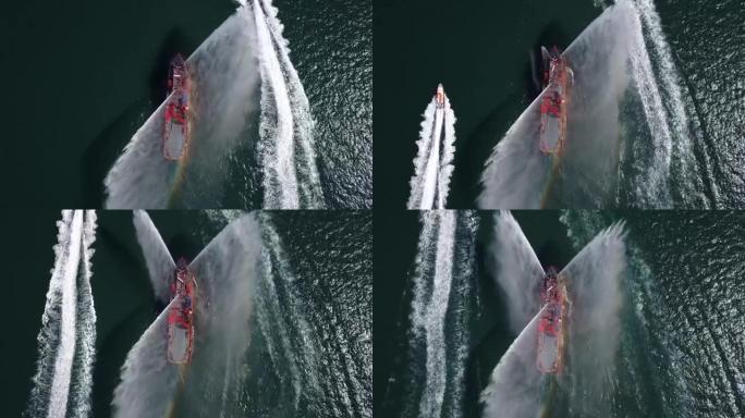 一艘漂浮的现代船舶喷射水柱，展示消防水枪，从无人机俯视消防艇喷水