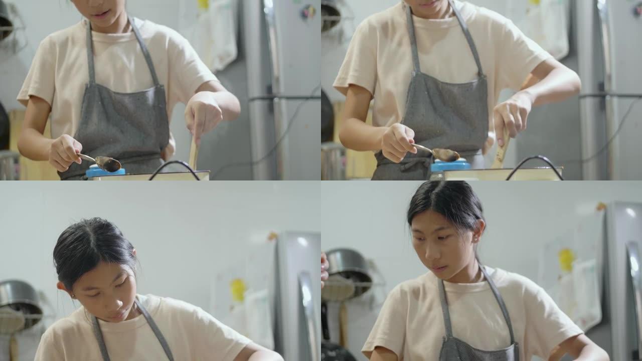 亚洲儿童穿着围裙在厨房一起制作焦糖爆米花，周末生活方式概念。