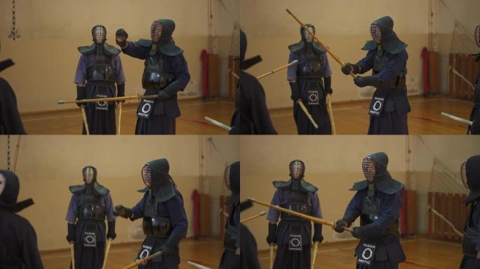 武术老师，向他的剑道学生展示与bokuto的正确动作，同时穿着特定的运动服