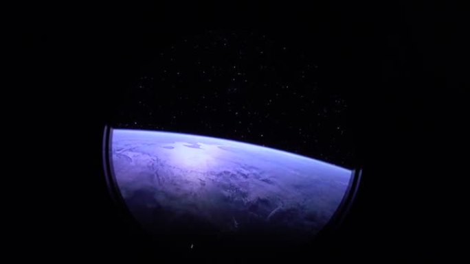 从国际空间站 (ISS) 的窗口可以看到地球。NASA和发现号。