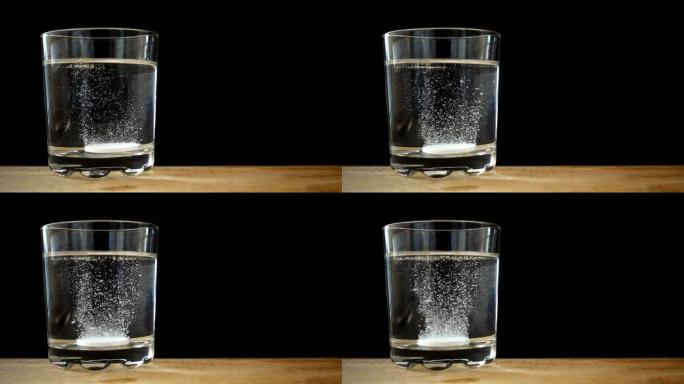 平板电脑在一杯水中以慢动作溶解