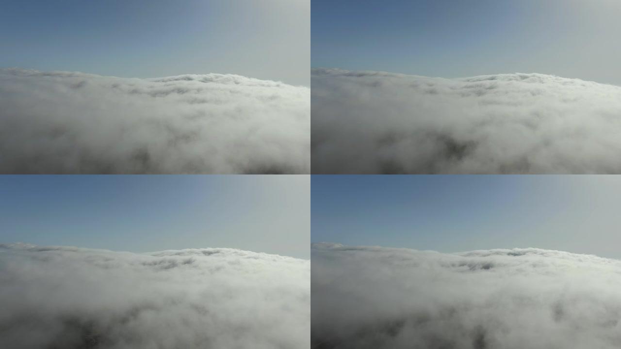 浓密的云层从地平线上穿过雾中的小孔延伸地球是可见的太阳光线不会突破浓密的窗帘