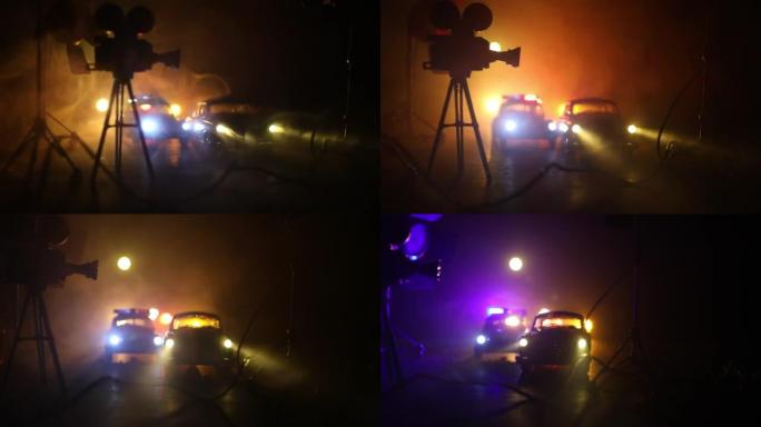 动作片概念。警车和微型电影背景为带雾的深色背景。警车在晚上追逐一辆车。犯罪现场事故。选择性聚焦