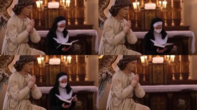 在罗马天主教堂里戴着防护面罩读圣经的修女。
