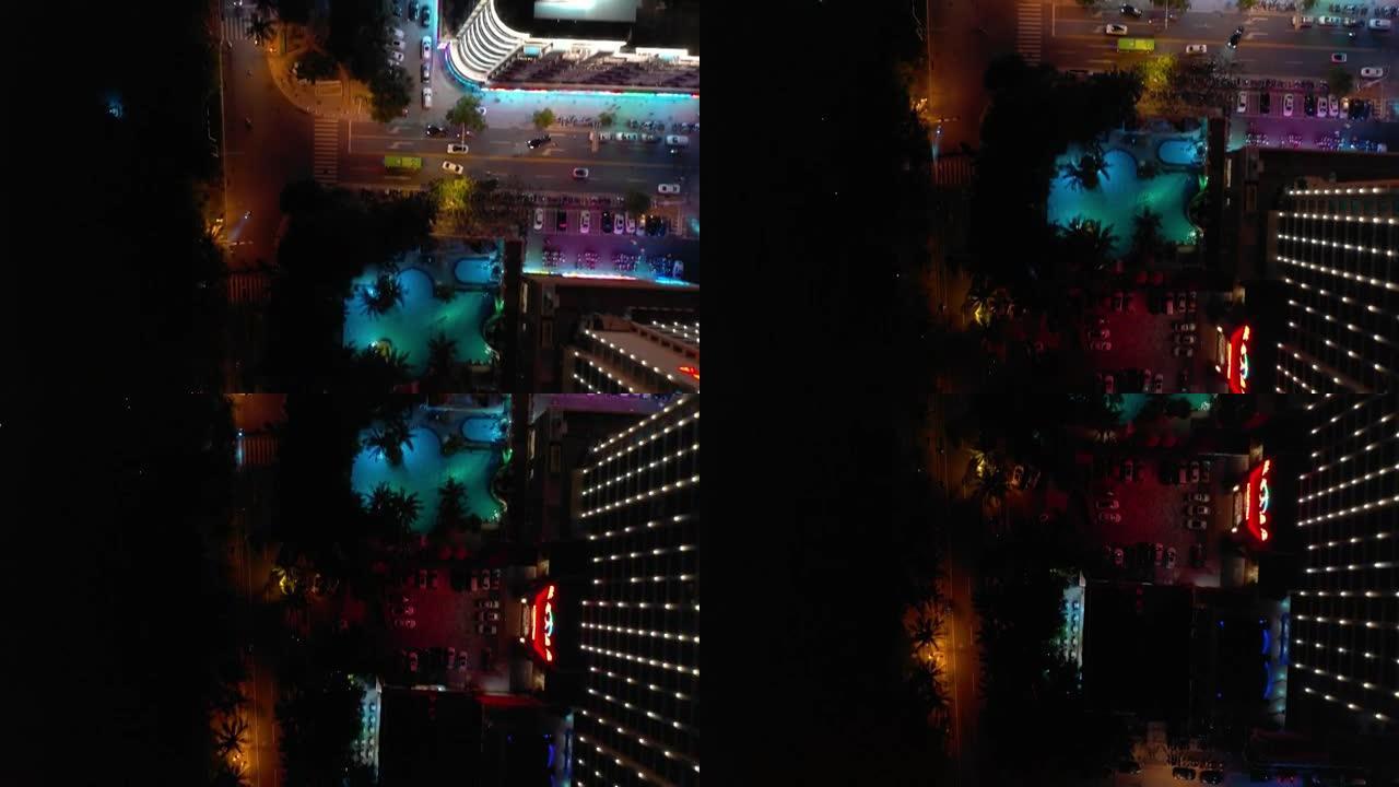 夜间照明海南岛三亚市交通街空中俯视图4k中国